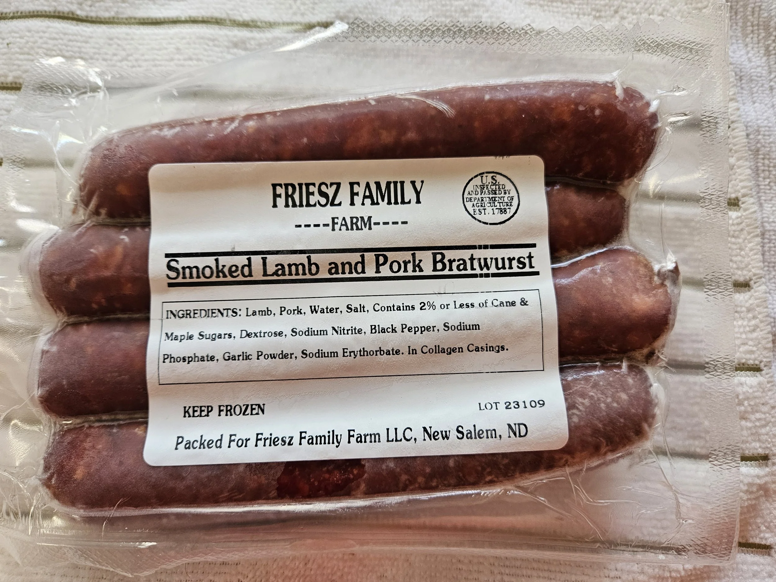A package of Friesz Family Farm smoked lamb and pork bratwurst